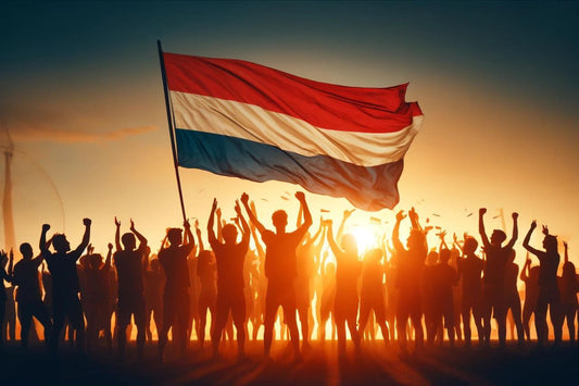 Grupo de personas enarbolando la bandera de los Países Bajos